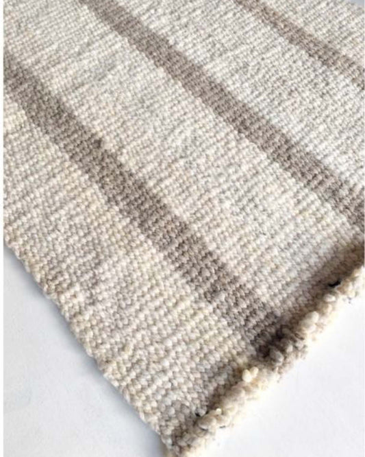 Handwoven wool rug beige and white