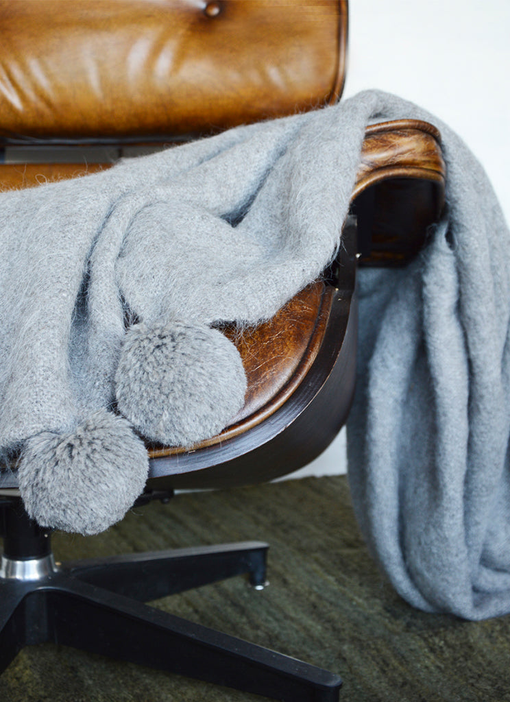 Handwoven llama wool throw silver grey pompoms