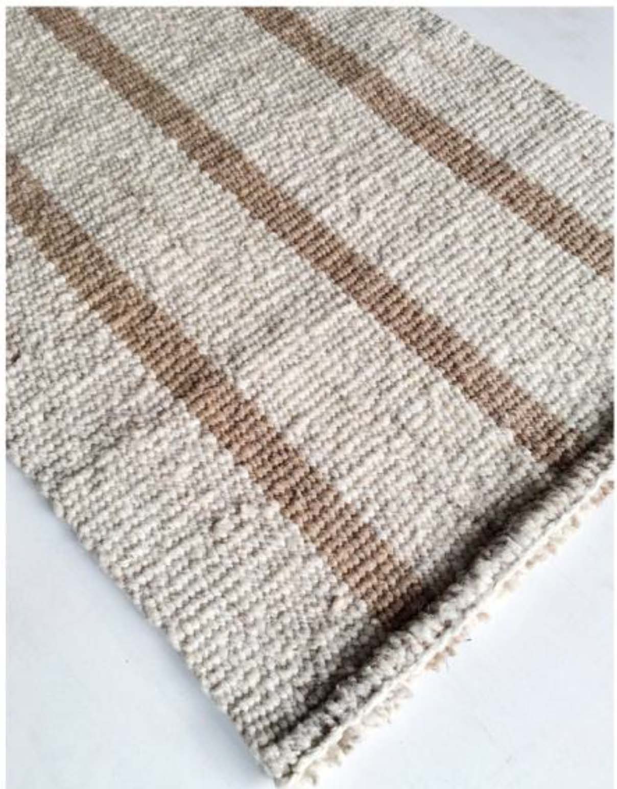 Handwoven wool rug beige and white