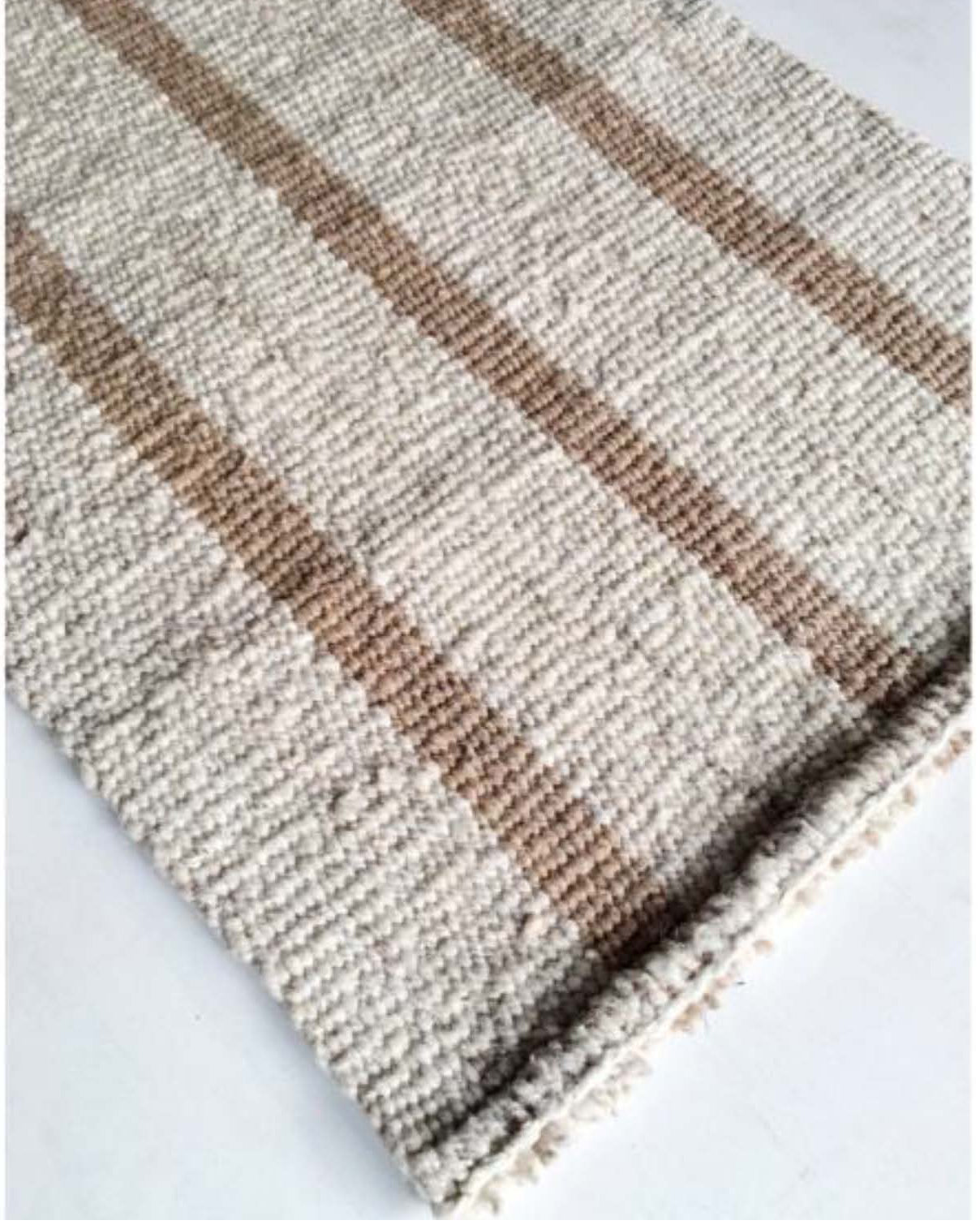 Handwoven wool rug beige and white