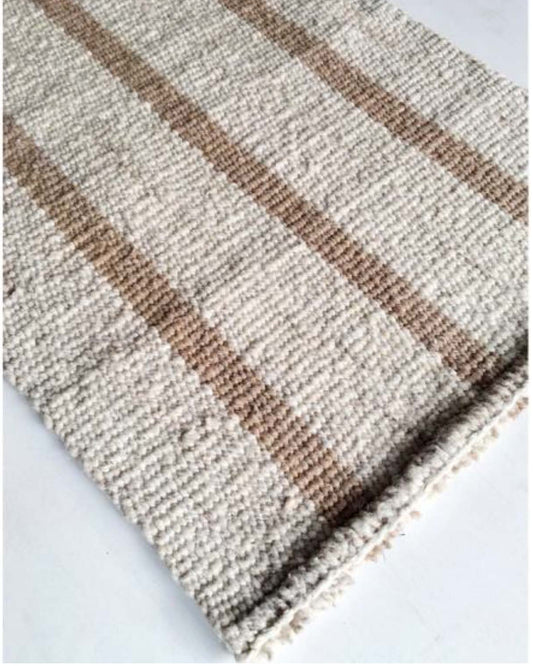 Handwoven wool rug beige and white