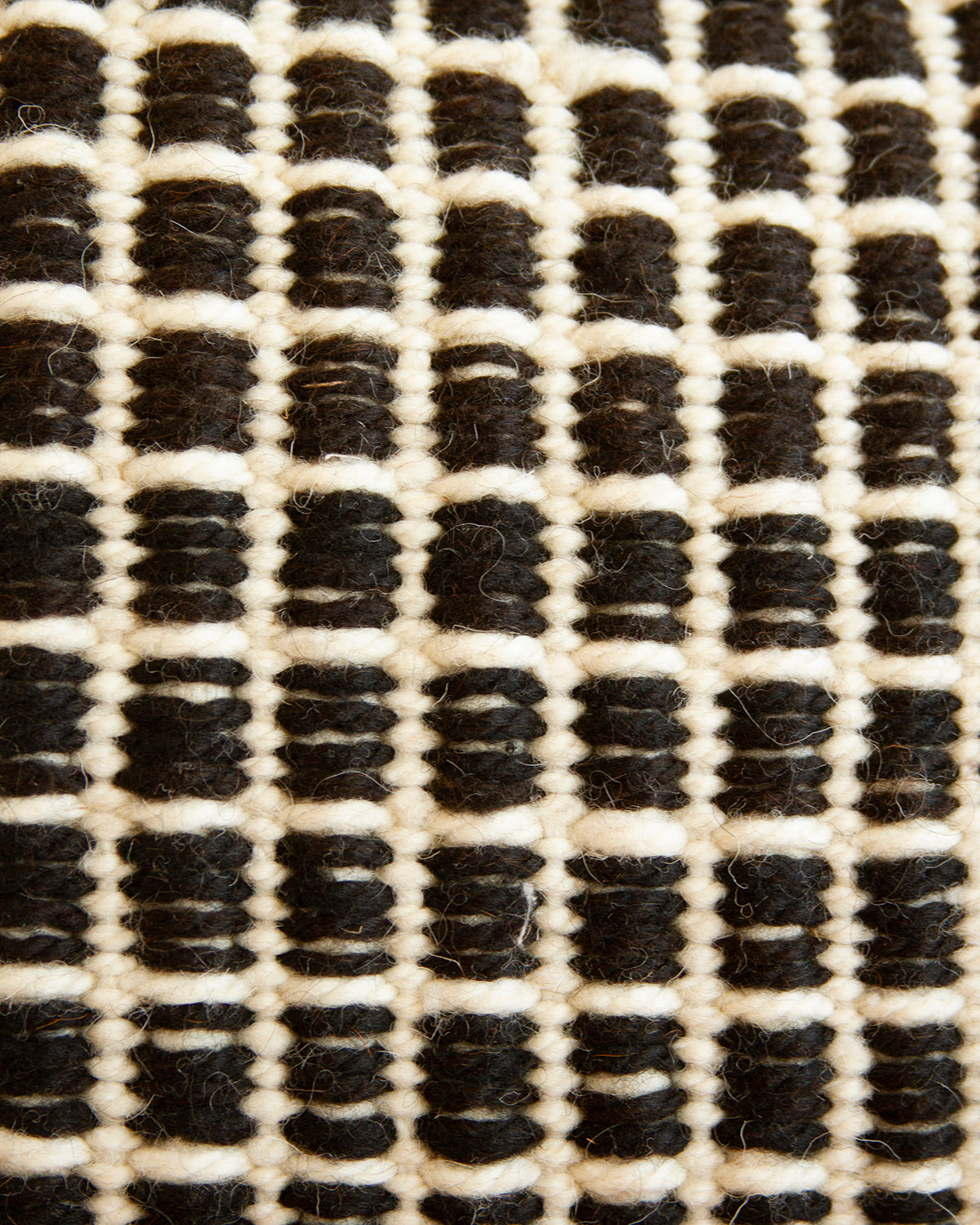 Panal Wool Throw Pillow in Black and White