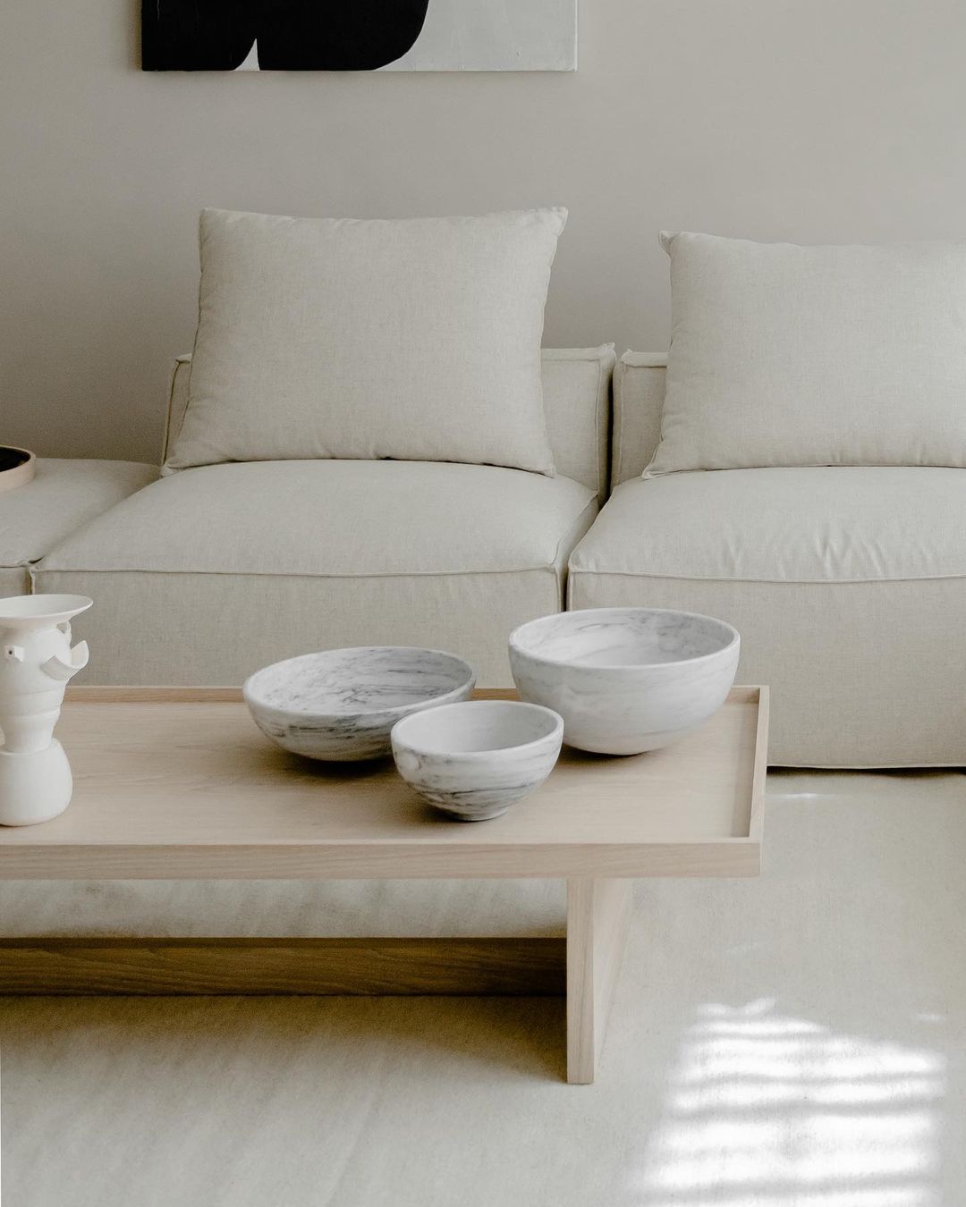 Group of white marble bowls in the three available sizes.