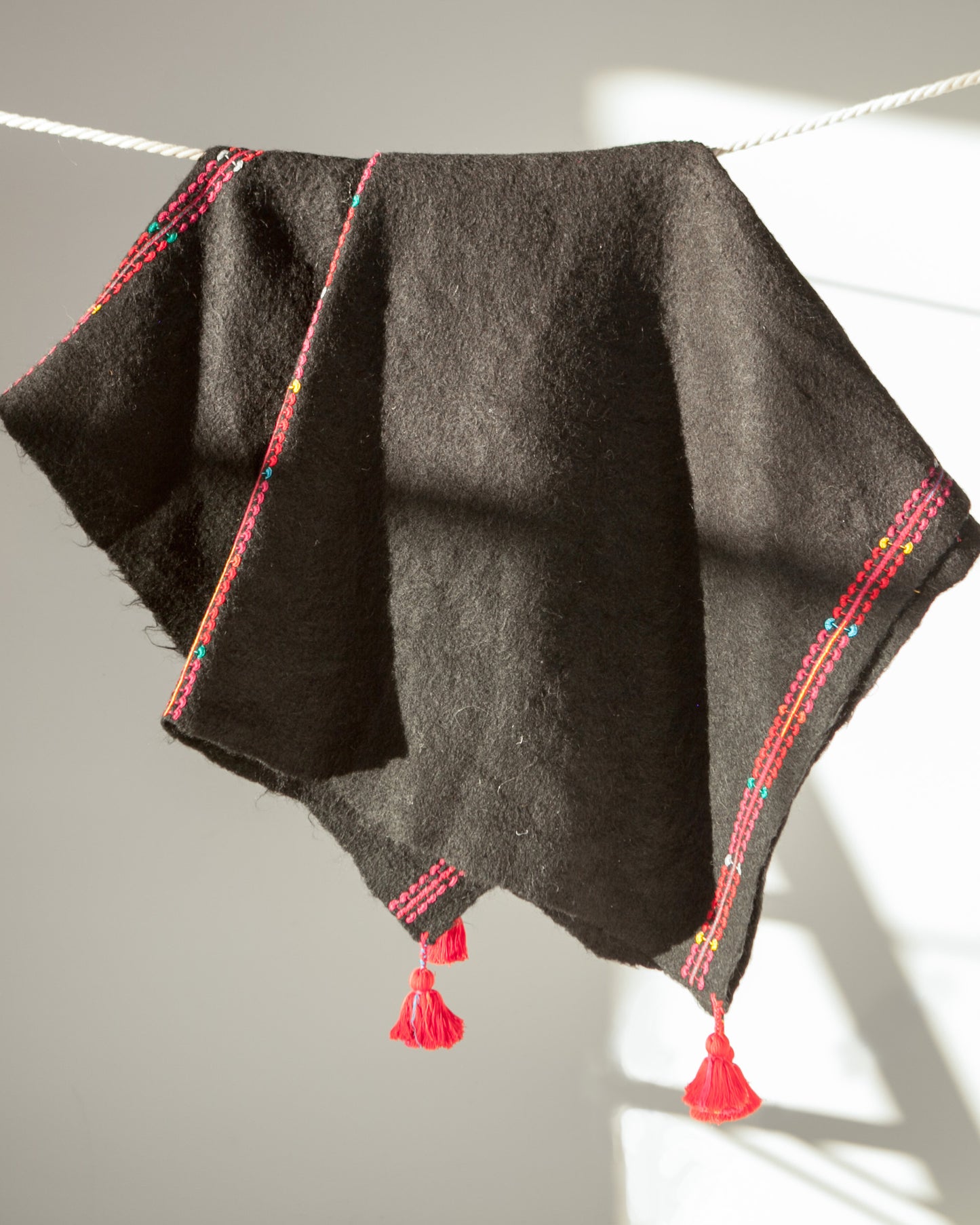 Handwoven wool throw black and red with tassels