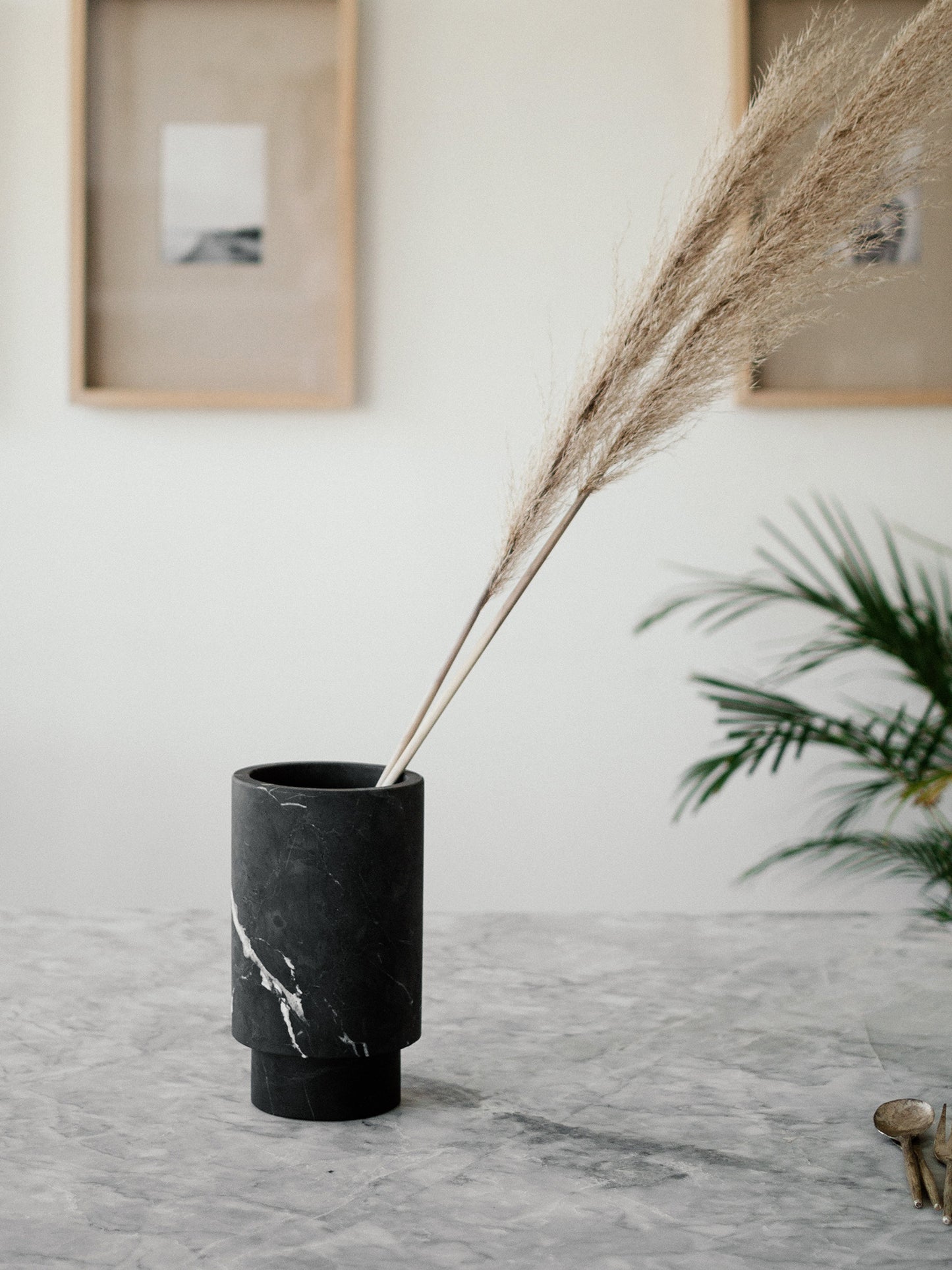 Black marble pedestal vase