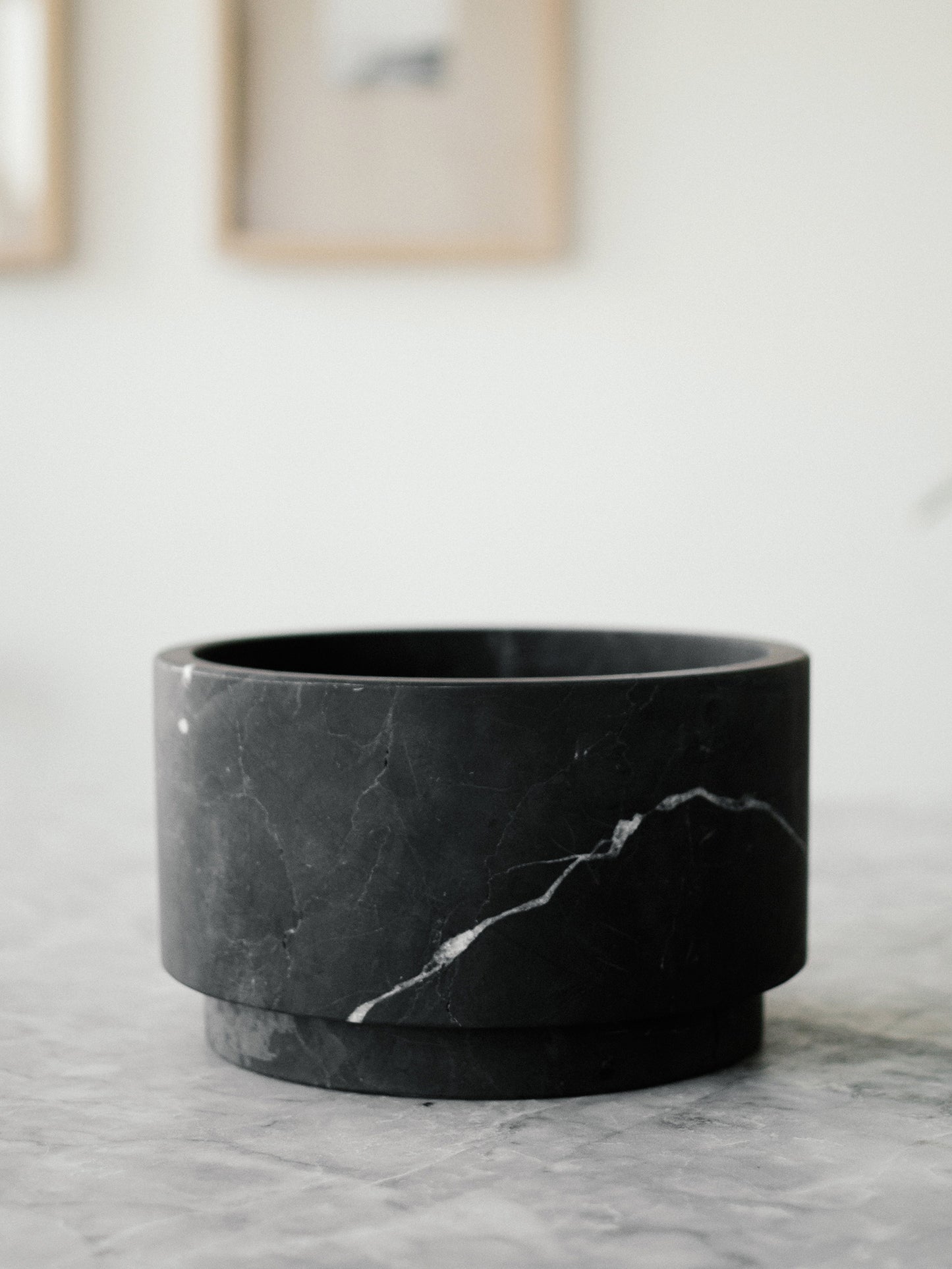 Black marble pedestal vase