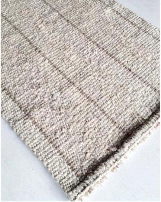 Handwoven wool rug beige and white