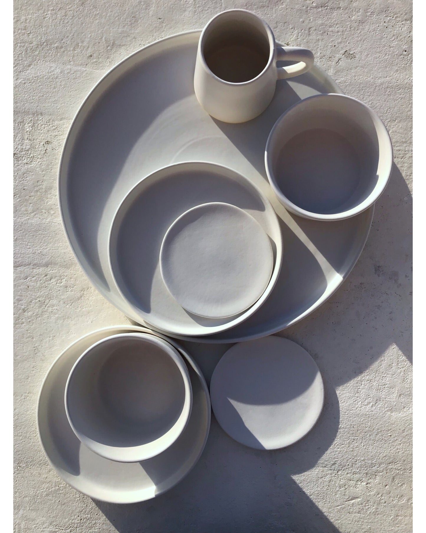 Matte plates, bowls, mug and saucer