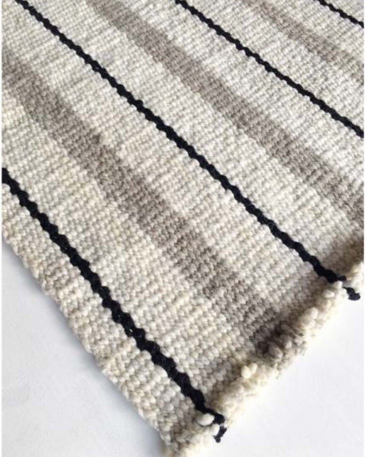 Handwoven wool rug black white and grey