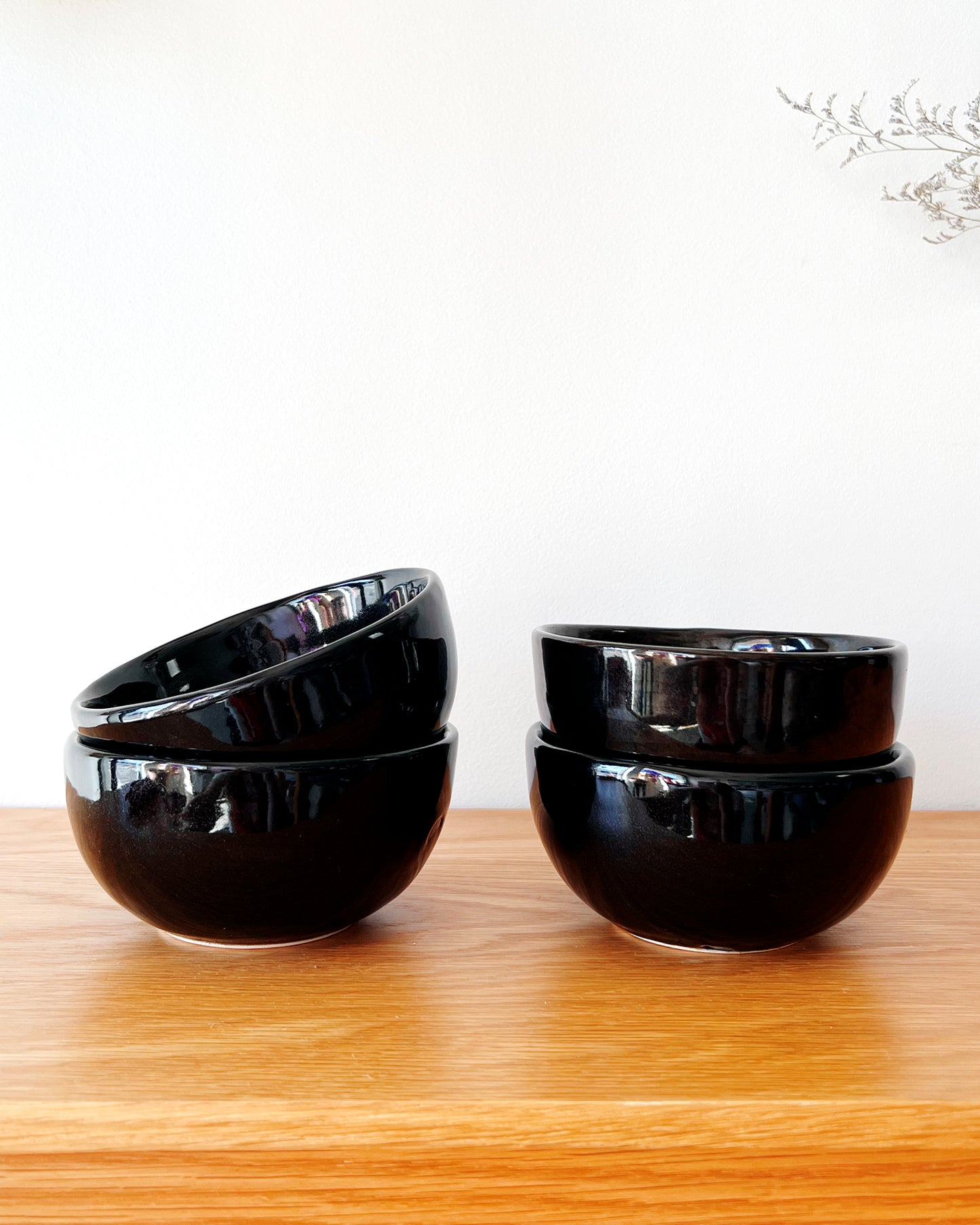 https://atacamahome.com/cdn/shop/products/black-glaze-handmade-small-soup-bowl-005.jpg?v=1665088939&width=1445