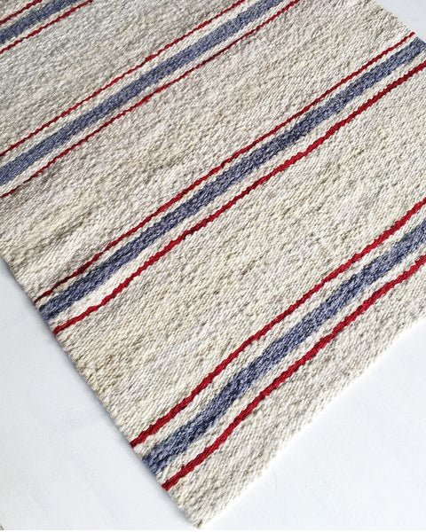 Handwoven wool rug white blue red